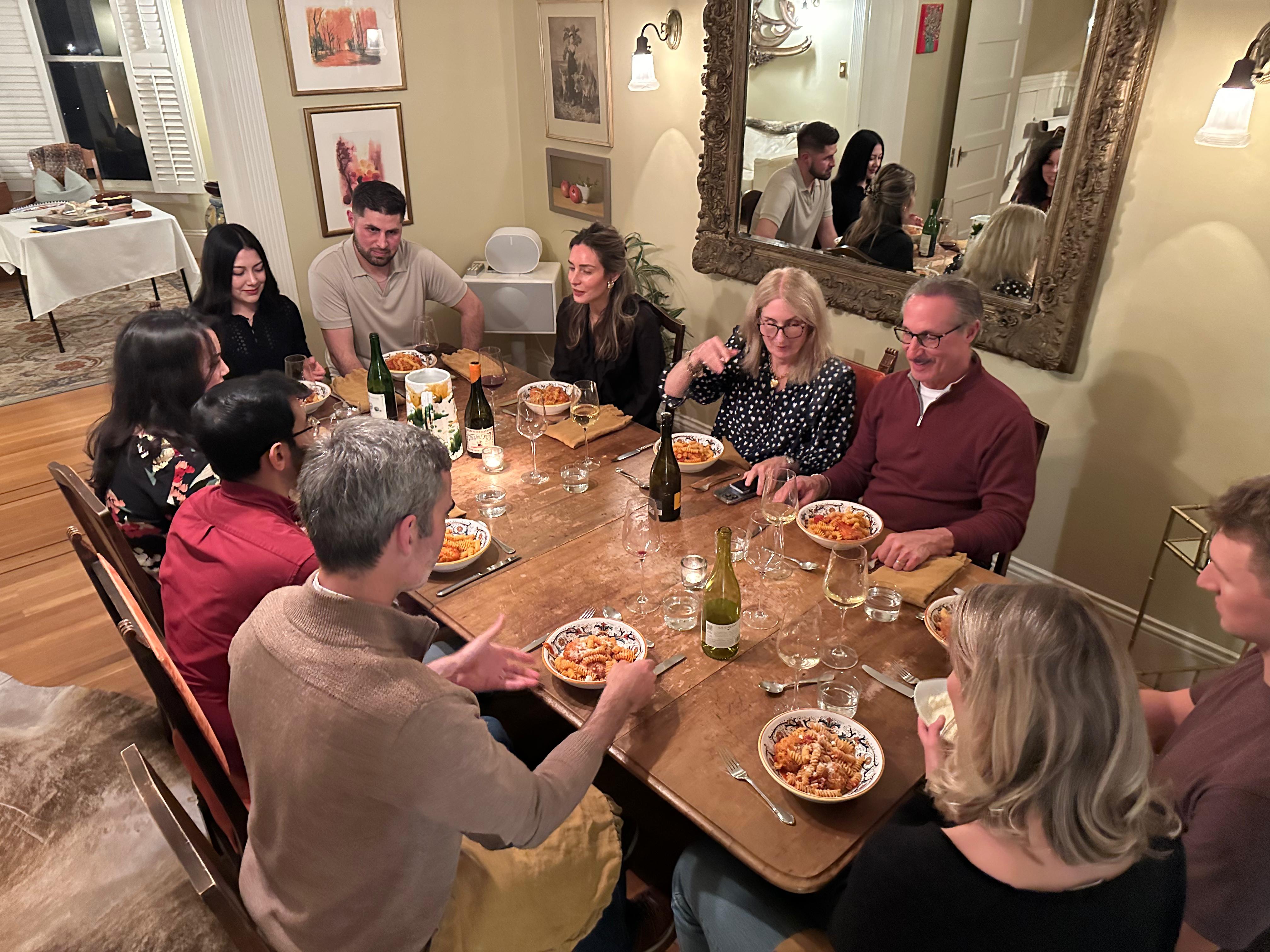 Guests enjoying a dinner party at CookWithJames in San Francisco