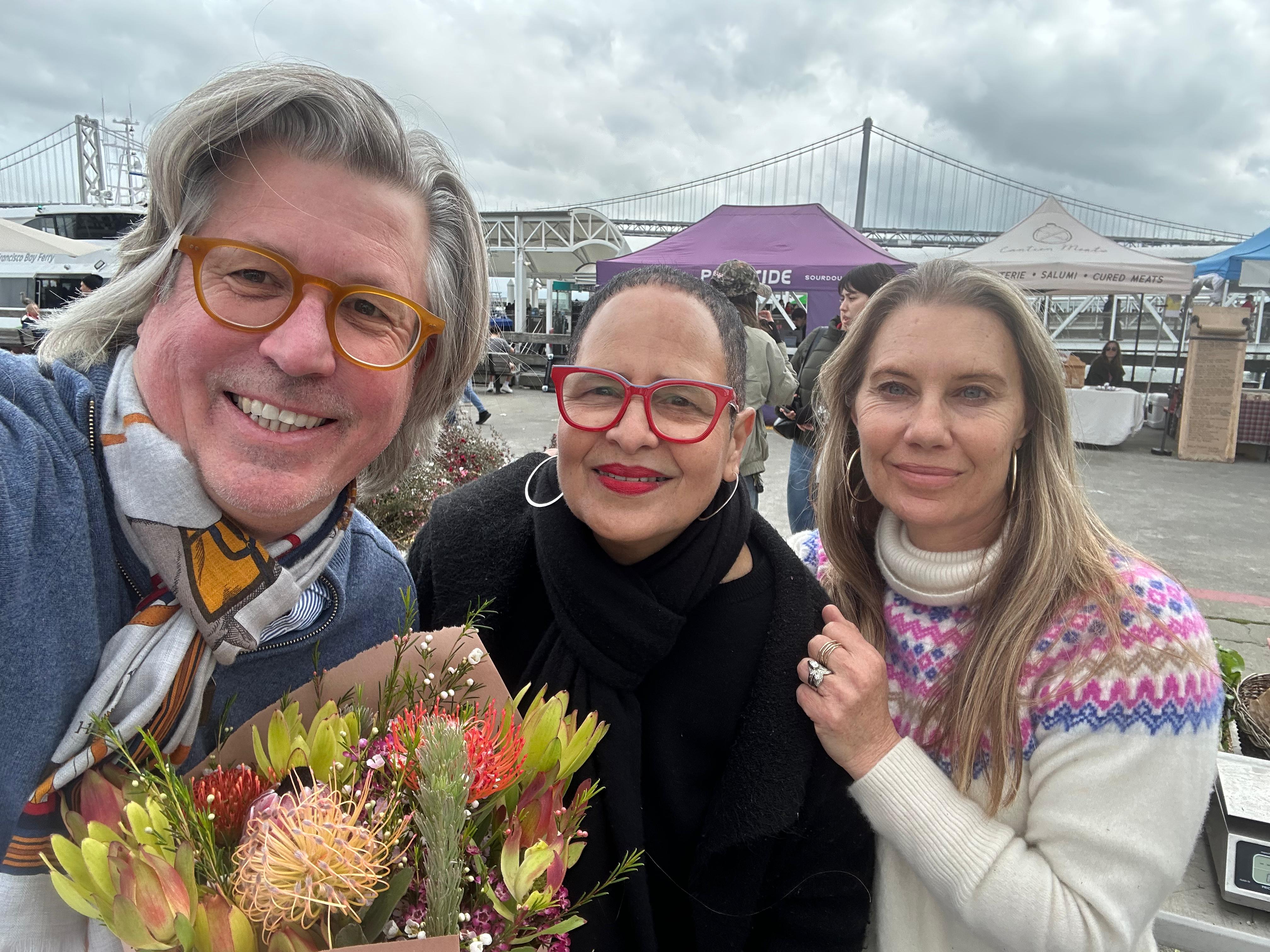 Chef James with farmers Jill and Tallia of Four Sisters Farms at the Ferry Building Farmers Market, San Francisco